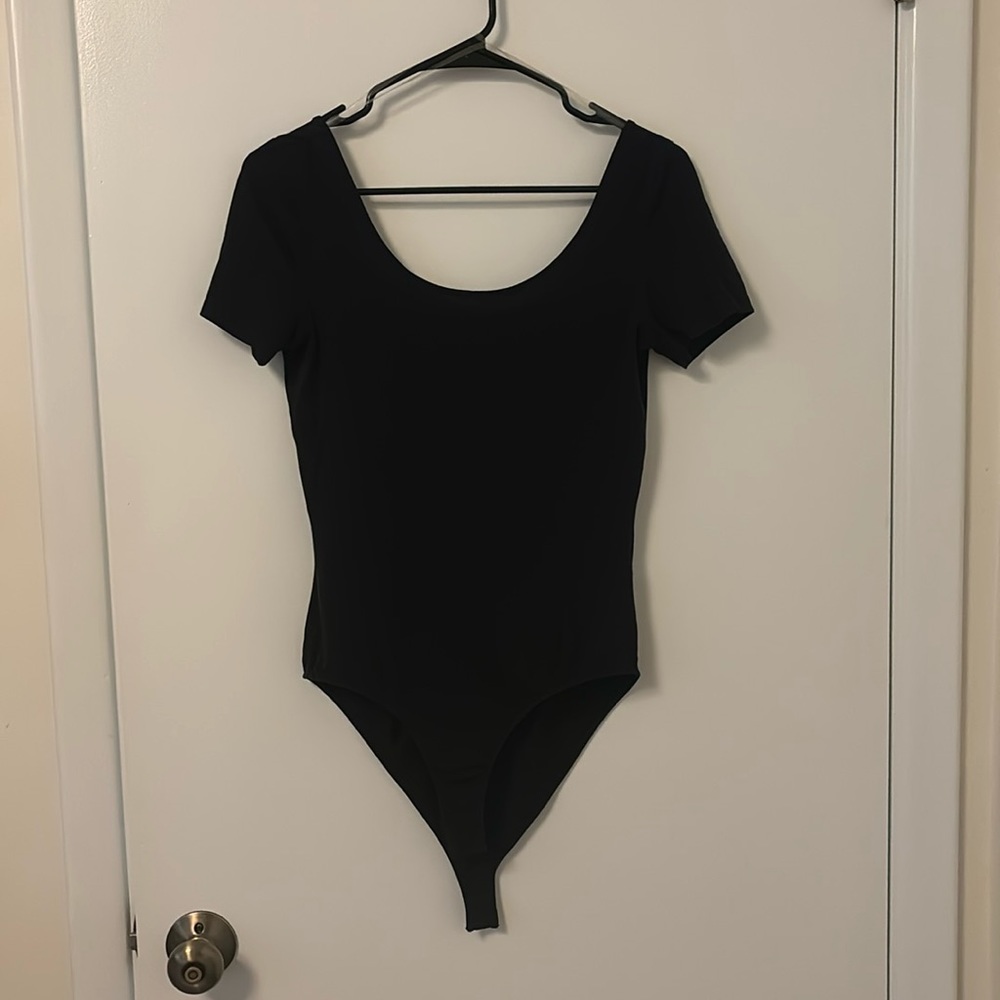 Black bodysuit. Low back.